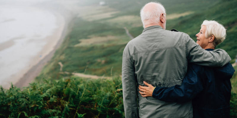 New Grandparent Couple Looking at Each Other on the Coast, Corona Estate Planning Attorney.