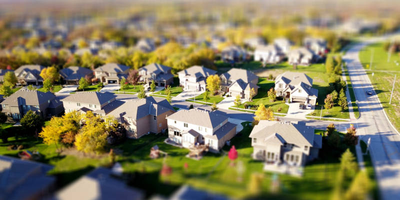 Houses viewed from the top on a clear sky Communicate With Homeowners, Corona Estate Planning Attorney.