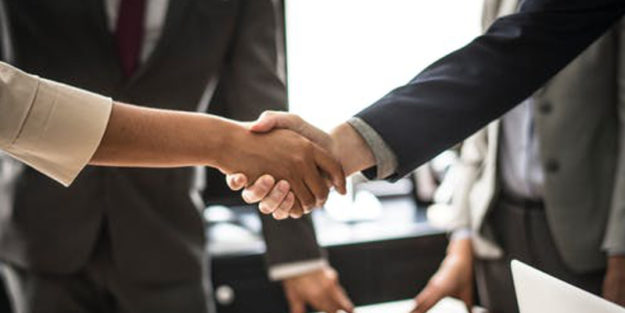 Hudack Law, Corona Estate Planning Attorney Handshaking.