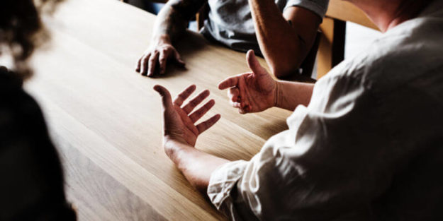 An Elderly Man Having Conversation With Son and Daughter on a Table, Corona Estate Planning Attorney.