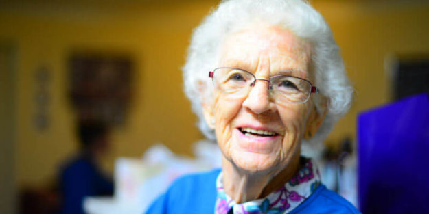 An Elderly Woman Smiling at Hudack Law Corona Estate Planning Attorney.