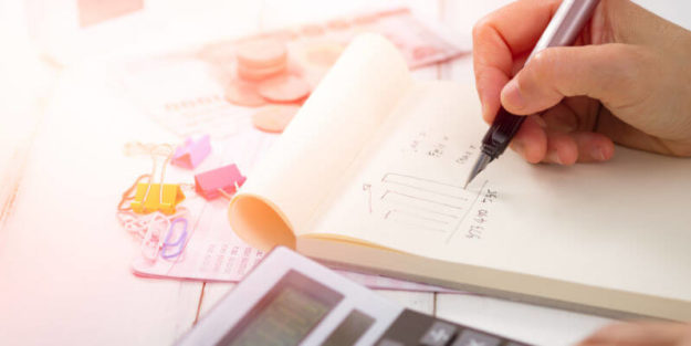 Calculator and Tax Prep Book Note With Bar Chart, Corona Estate Planning Attorney.