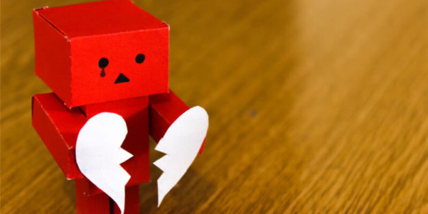 Red Amazon Danbo on Brown Wooden Surface Tearing in Two a Paper Heart, Corona Estate Planning Attorney.