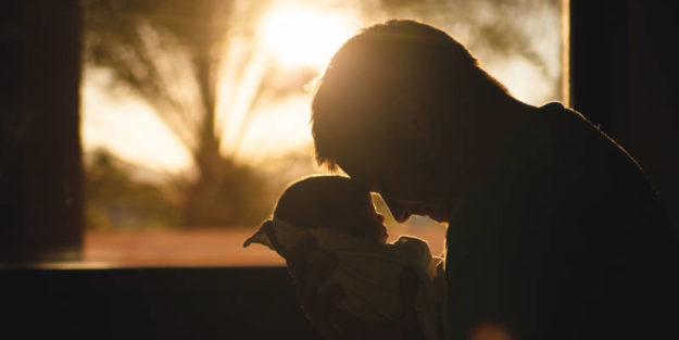 Father and a Baby Son Forehead Each Other With a Sunset in the Background, Estate Planning Attorney.