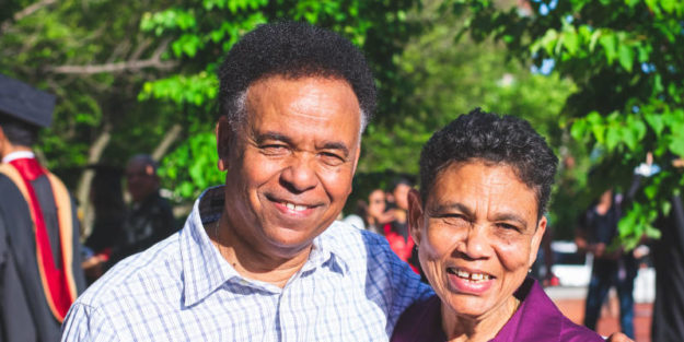 Smiling Woman and Man Hugging on a Graduation Ceremony, Estate Planning Attorney.