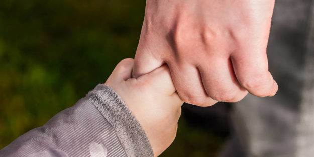 Baby Hand Holding the Finger of a Man's Hand, Estate Planning Attorney.