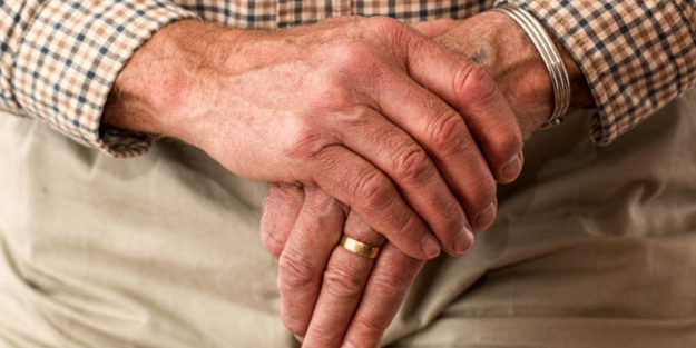 Hands of an Elderly Holding a Rod, Estate Planning Attorney.