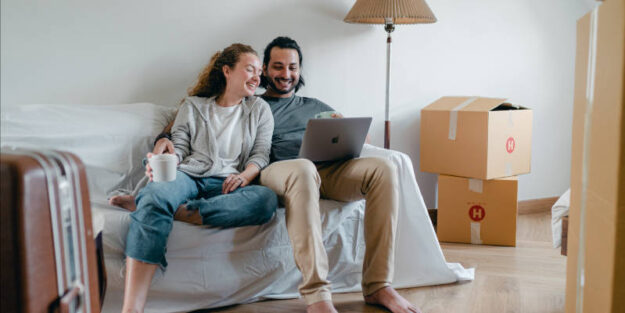 A Couple Watching Laptop While on the Sofa, Estate Planning Attorney.
