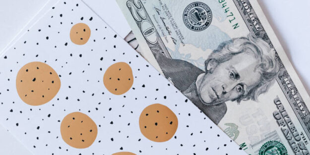 A Gift Envelope With a Heap of Greenbacks on a Marble Table, Corona Estate Planning Attorney.