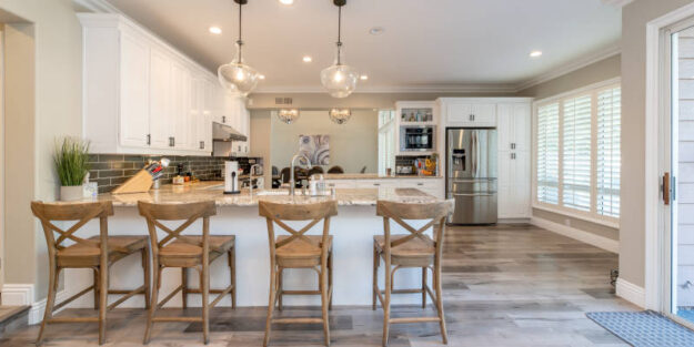 A kitchen with Four Brown Wooden Chairs, Corona Estate Planning Attorney.