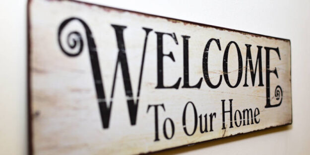 A Print Brown Wooden Wall Decor That Says "Welcome to Our Home", Corona Estate Planning Attorney.