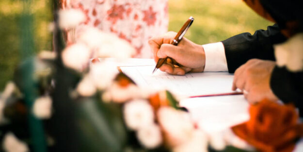 An Attorney Signing A Will Or A Trust On A Table, Corona Estate Planning Attorney.
