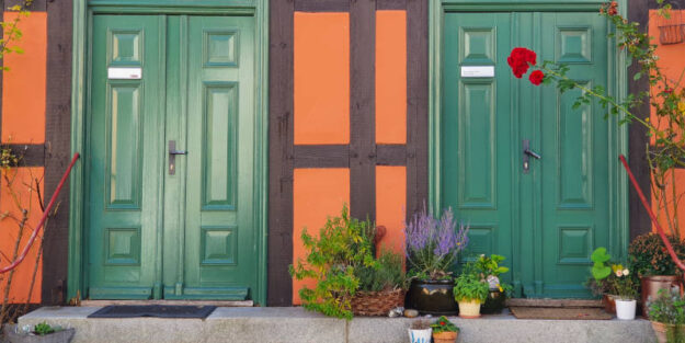Two Green Doors With Flowers At The Entrance, Corona Estate Planning Attorney.