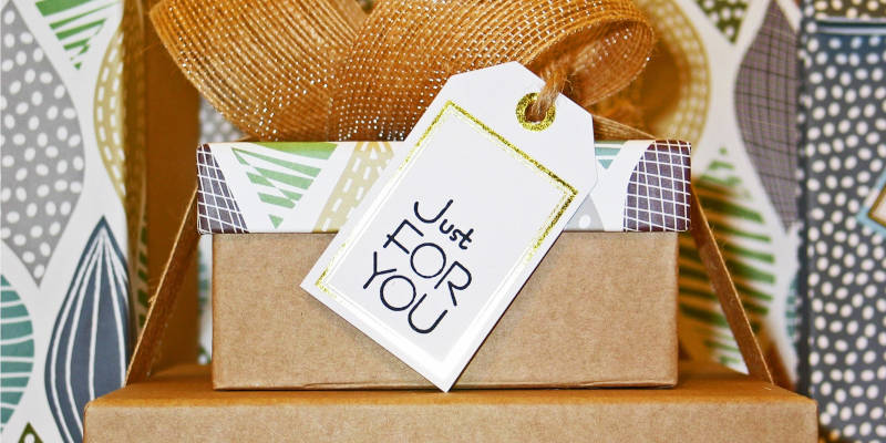 Four Stack Gifts Boxes And A Label That Says, "Just For You". Cure Medicaid Penalty Period by Returning a Gift